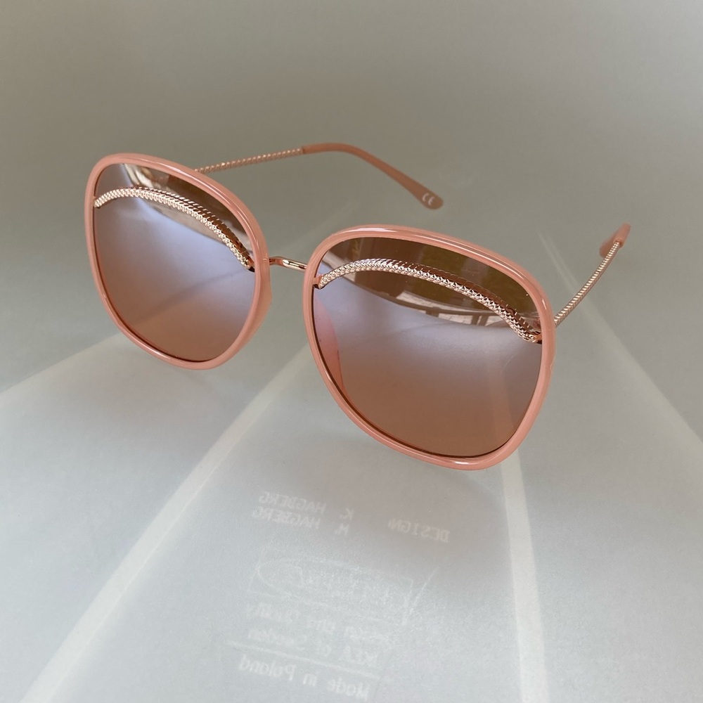 Oversize Rose gold sunglasses.